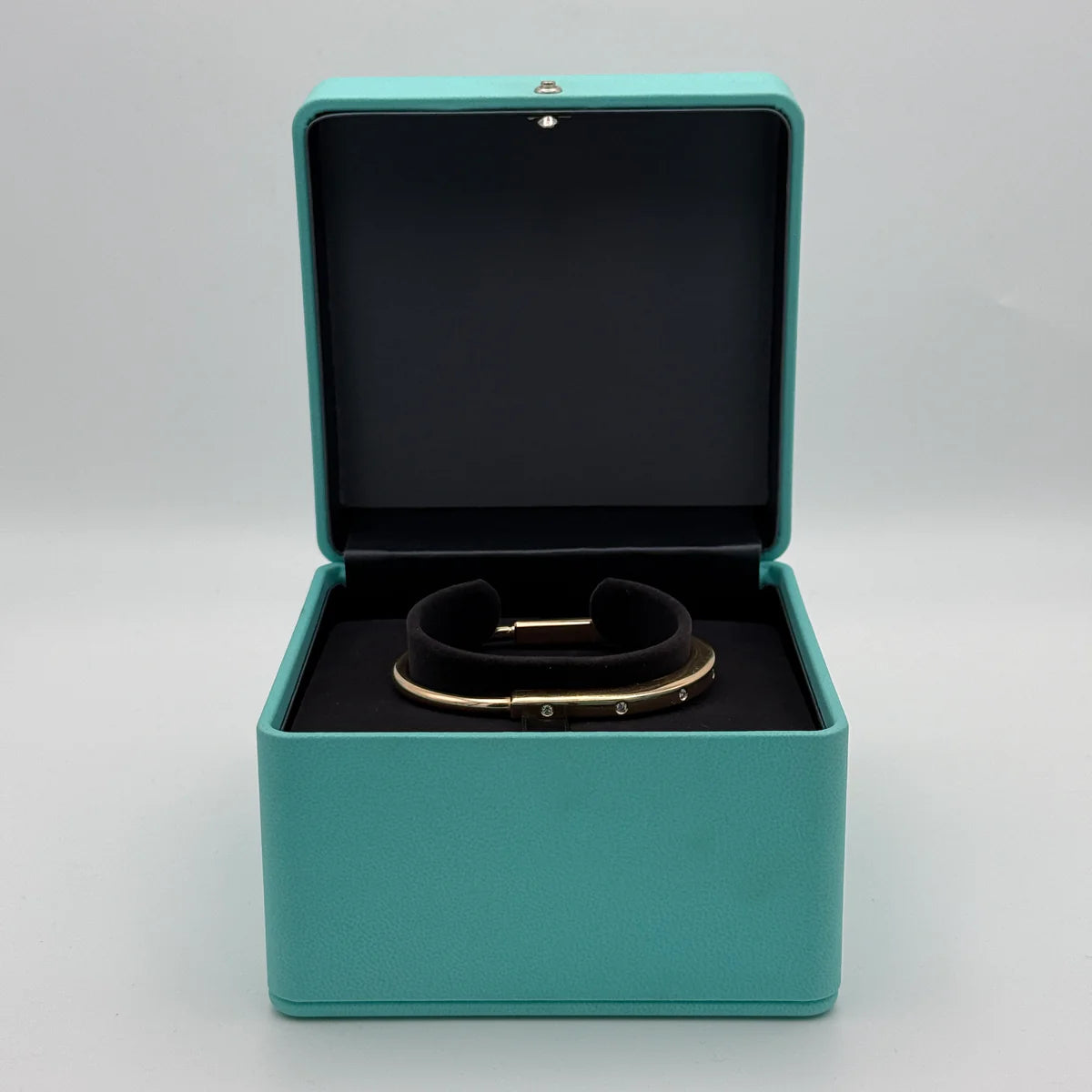 TIFFANY & CO DIAMOND LOCK BANGLE YELLOW GOLD WITH DIAMOND ACCENTS